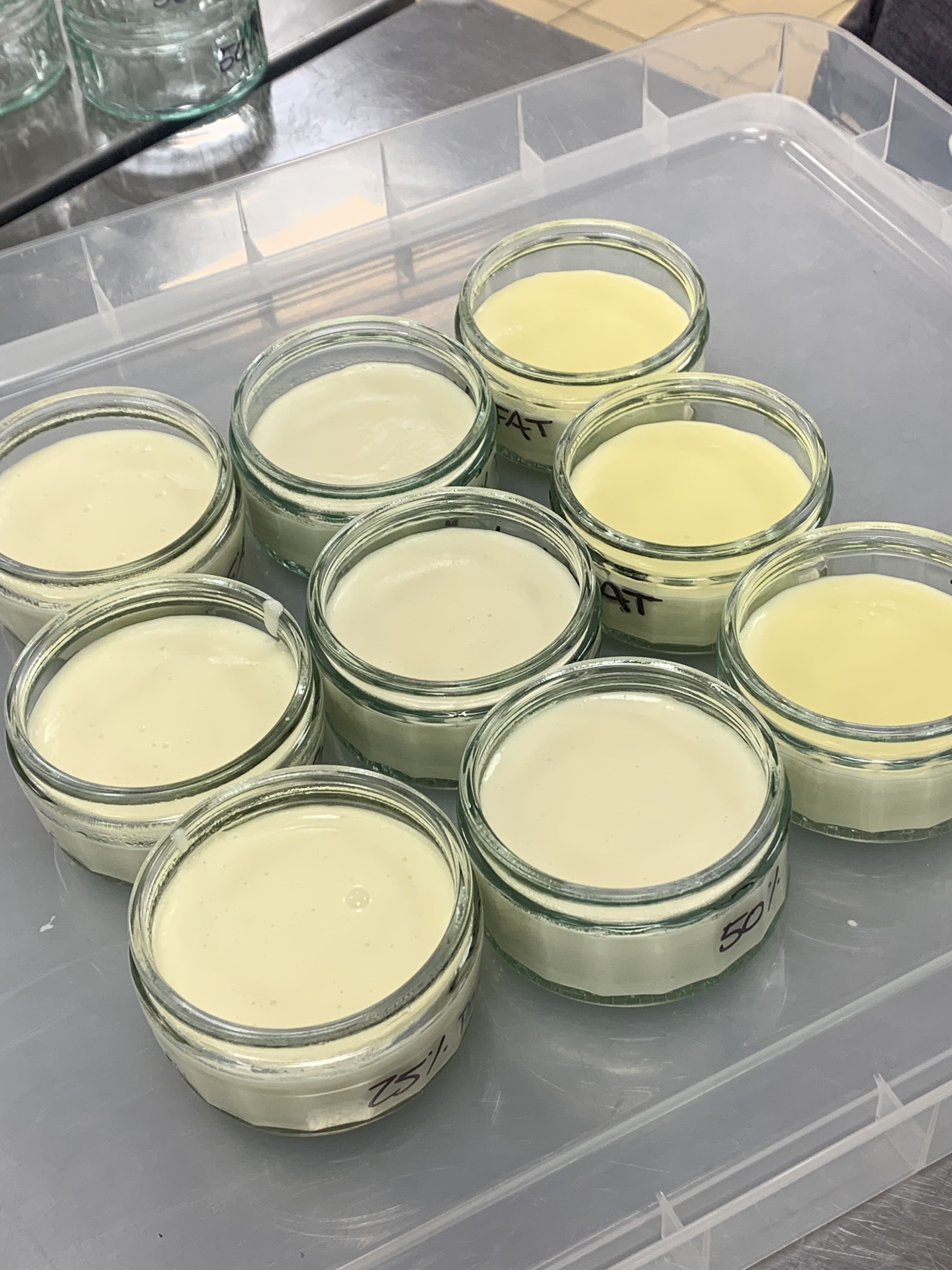 A panacotta-like product made with the microgel in nine small glass dishes.