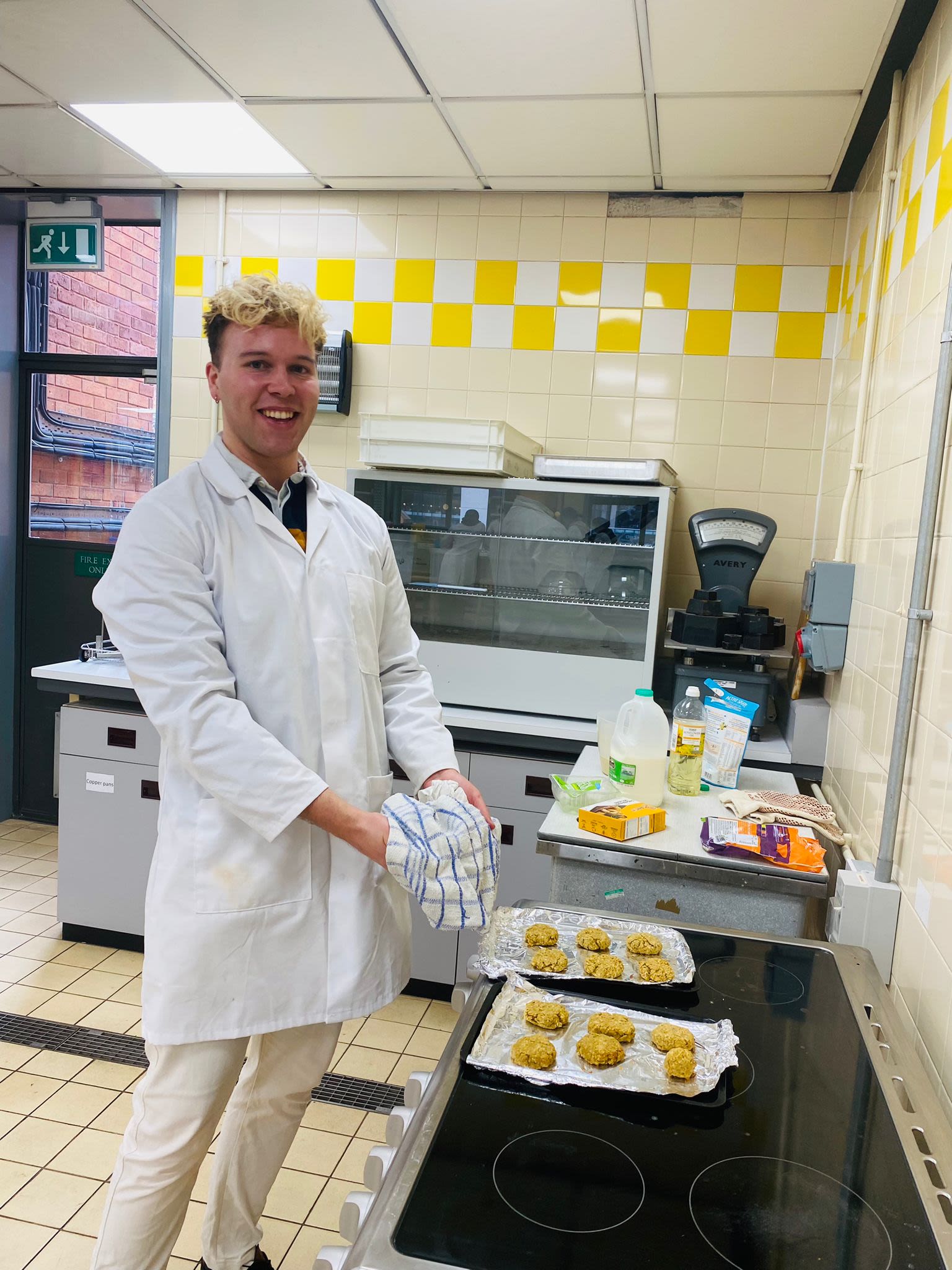 Dr. Ben Kew preparing food in a laboratory kitchen