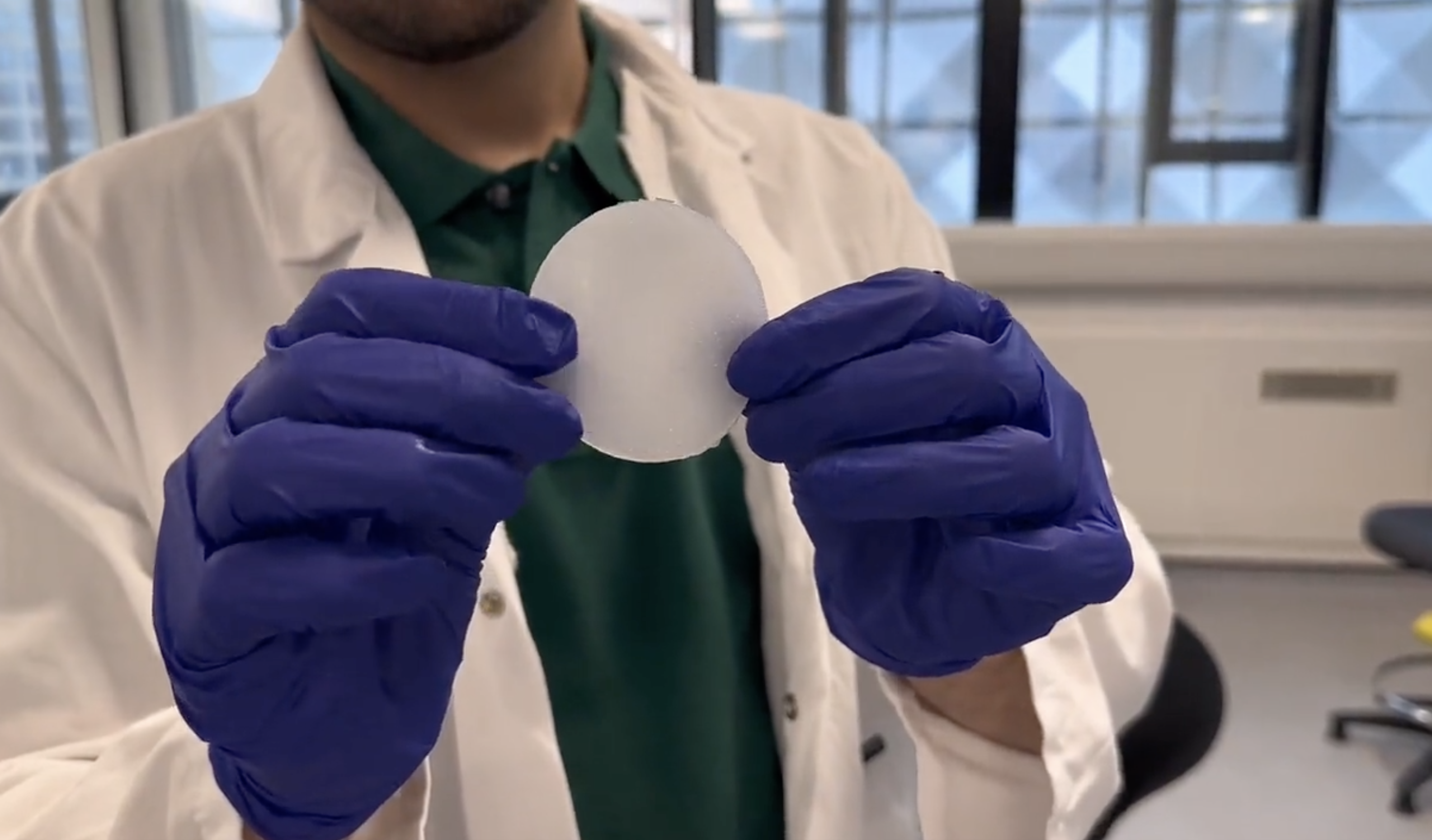 Person holding 3D printed tongue simulator