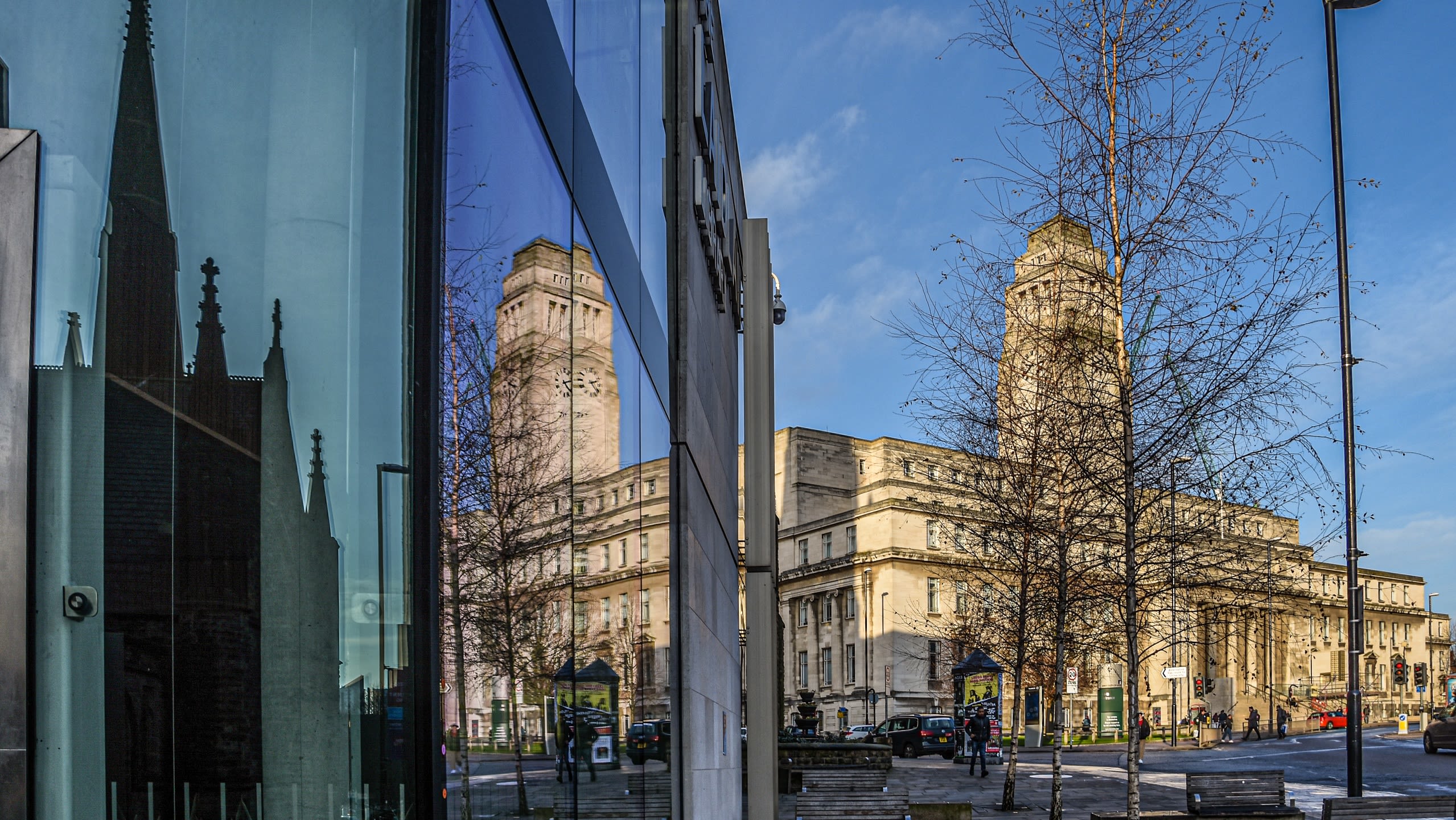 Reflection of Parkinson in the Laidlaw Library window on a winter's day with a blue sky in the background