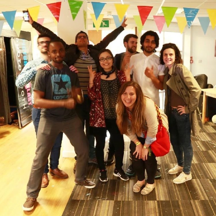 Mohsin Abdin and a group of friends pose for a photo at a party