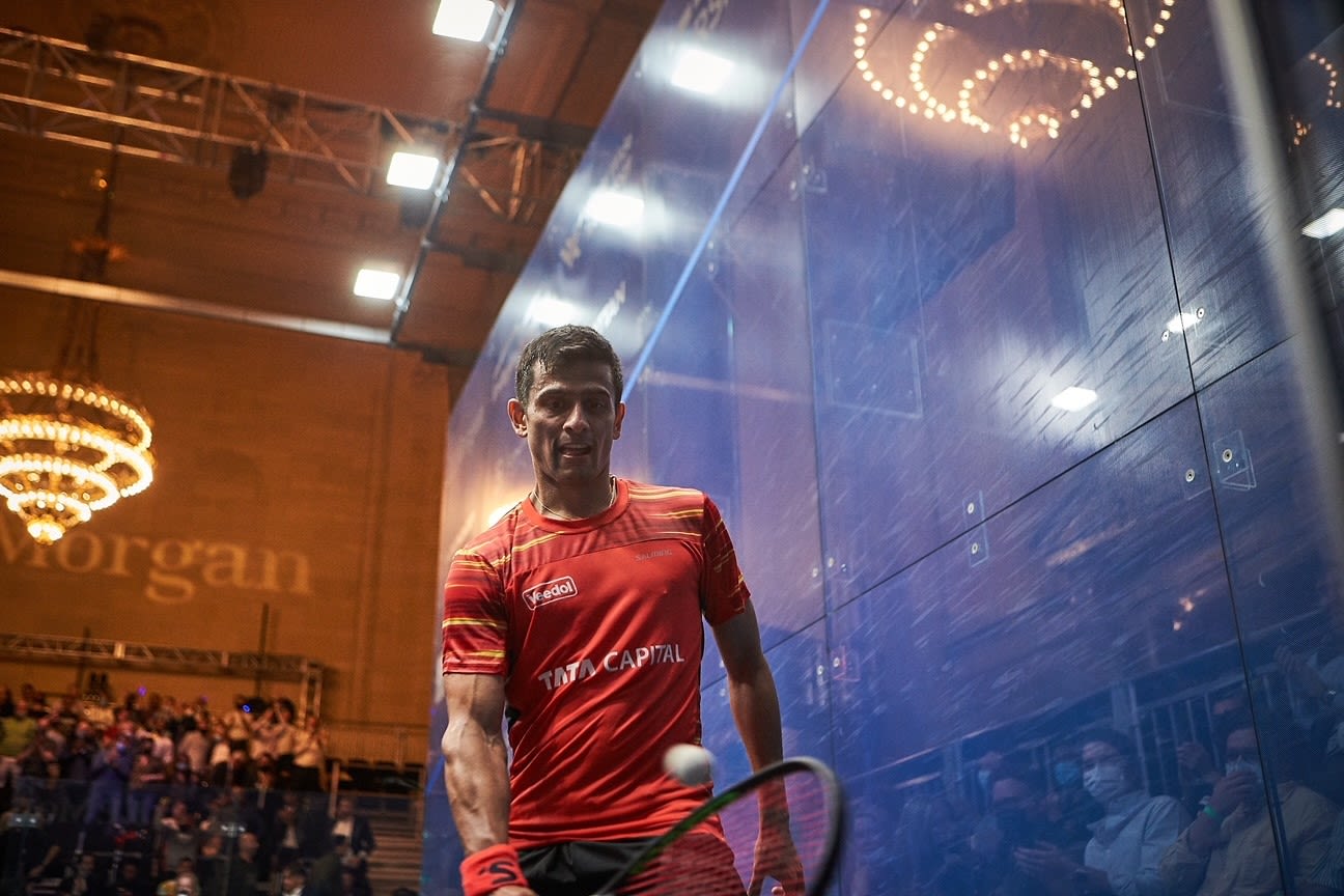 Saurav Ghosal on the squash court wearing a red jersey