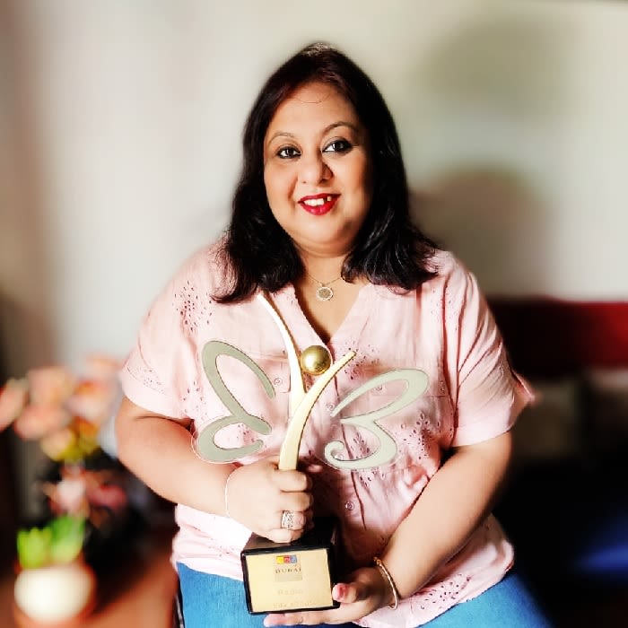 Photo of Swagata Majumdar holding a trophy