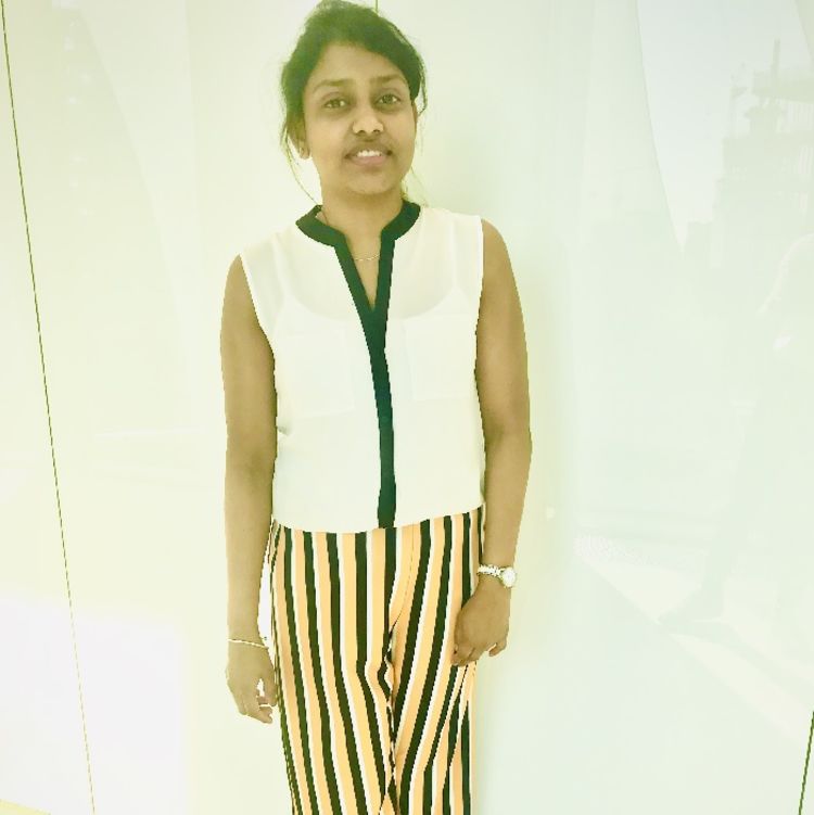 Photo of Vishnupriya Shantha Kumar wearing a white blouse and striped trousers