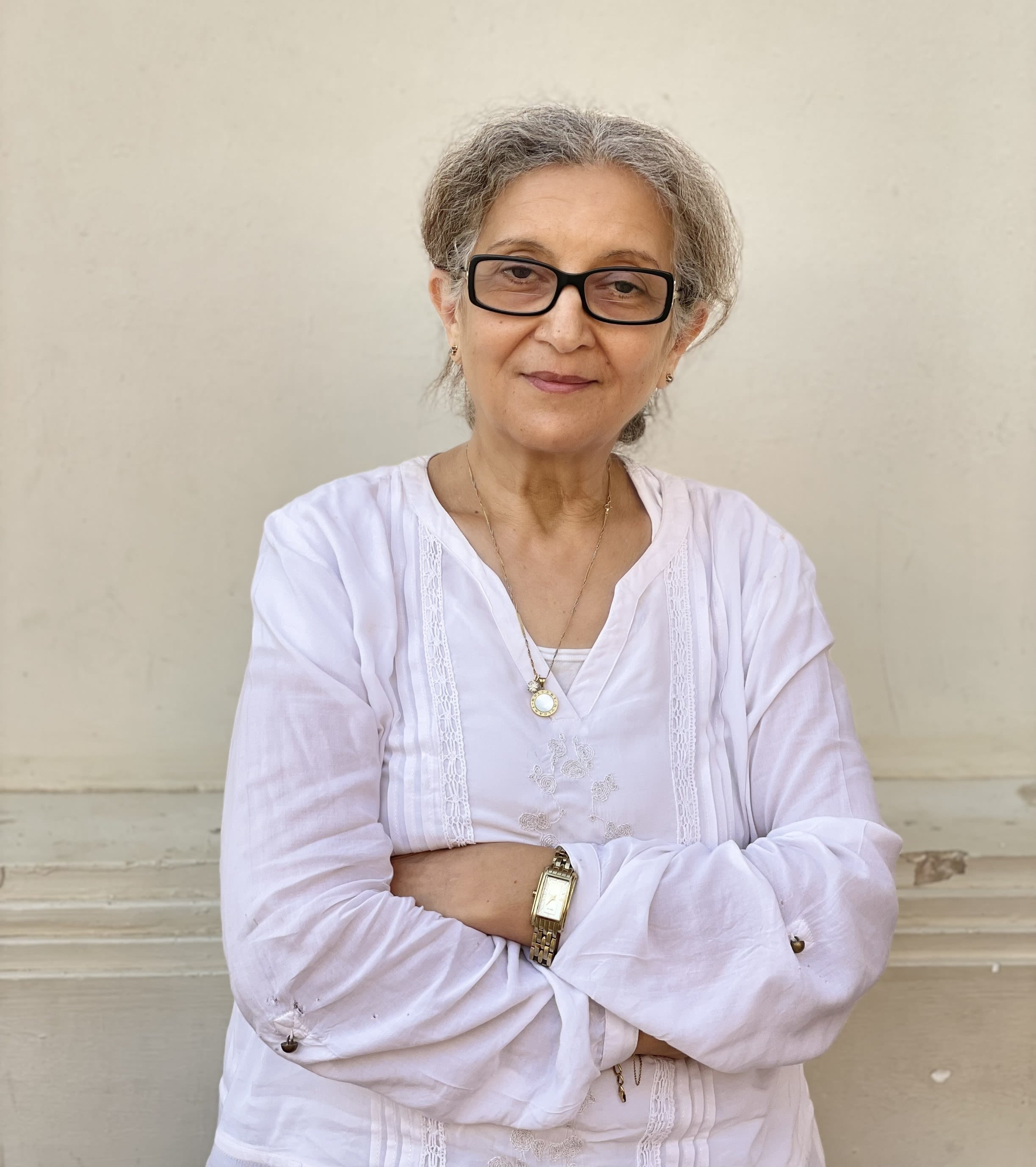 woman with crossed arms looking at camera