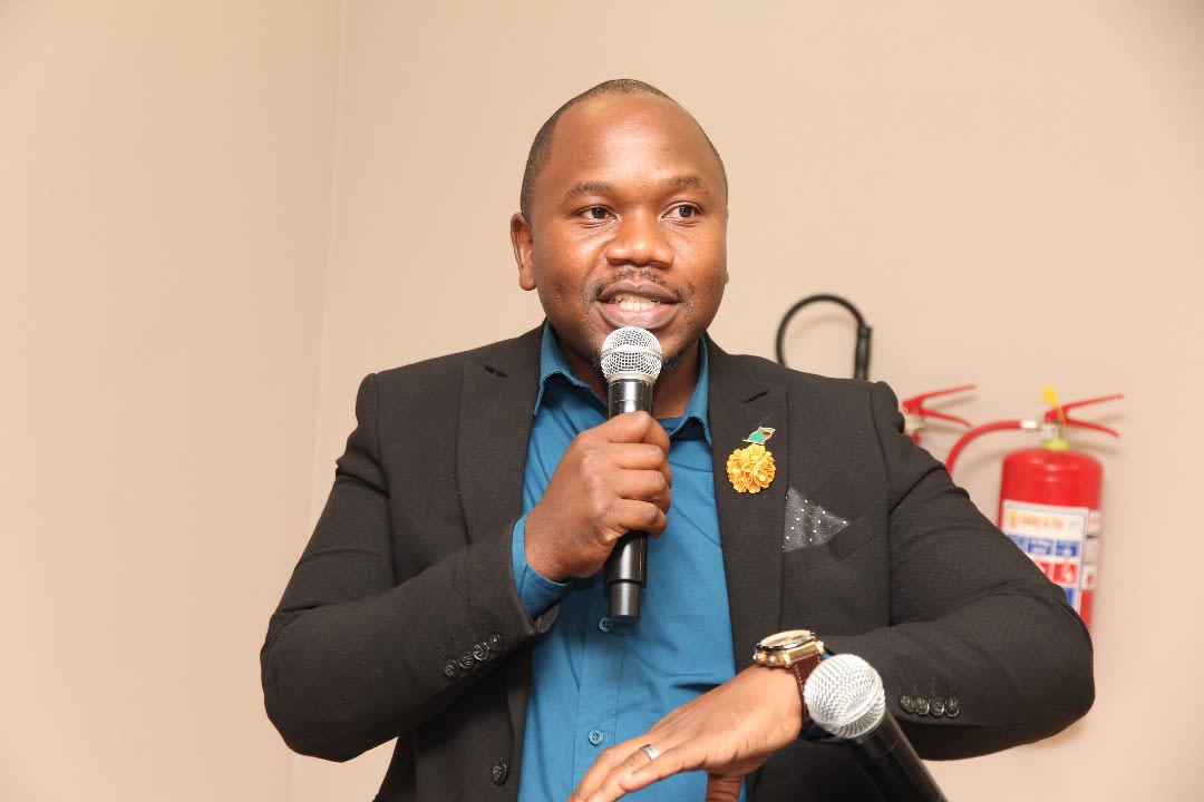 man speaking into microphone