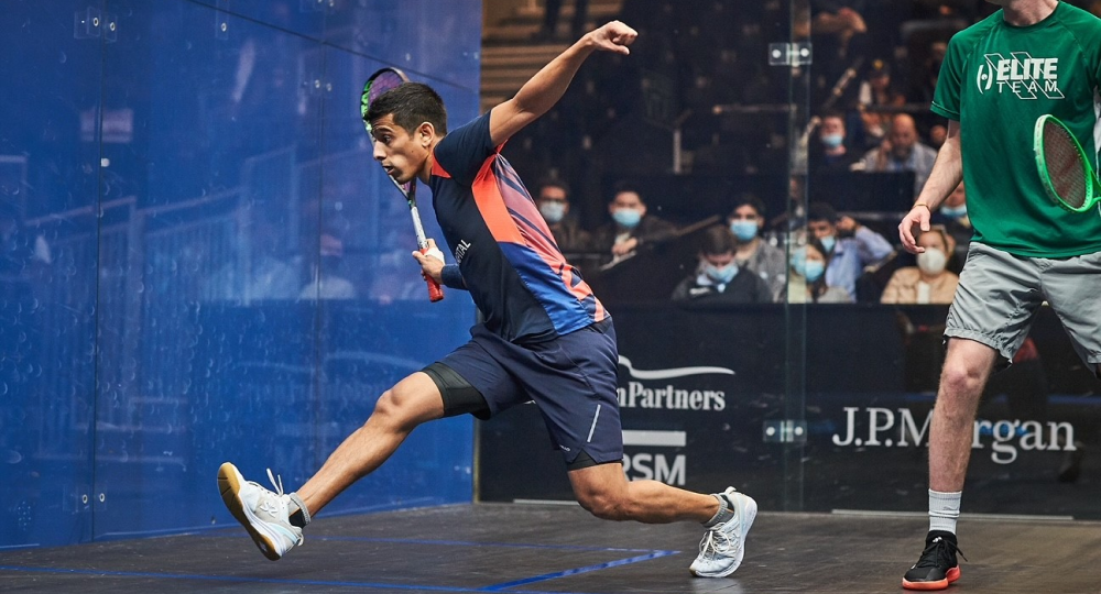 Saurav in action on court, swinging his racket