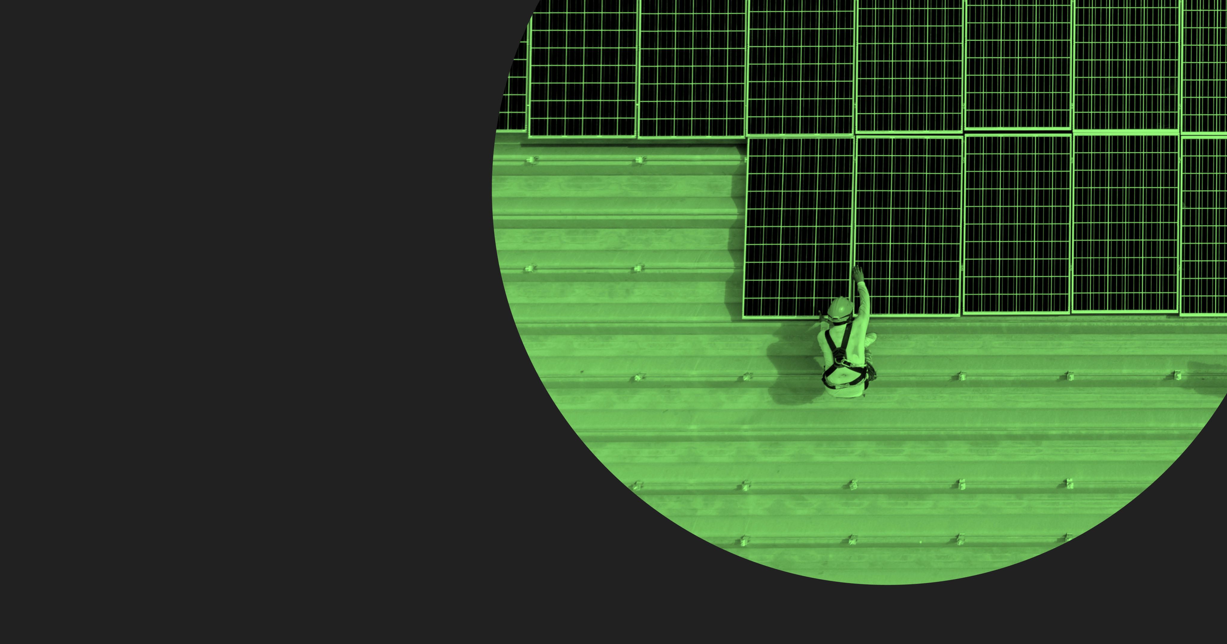 Worker lays solar panels down