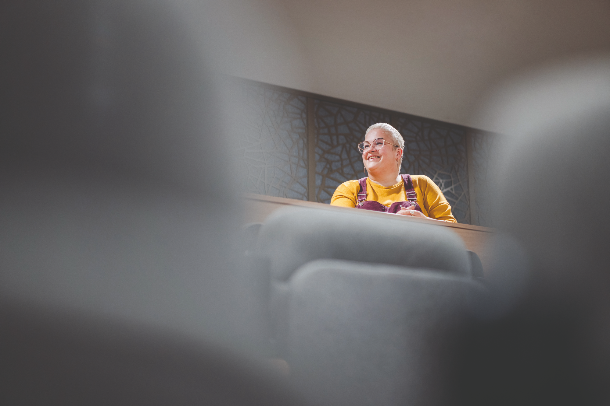 Sadie Augier sits in a lecture theatre
