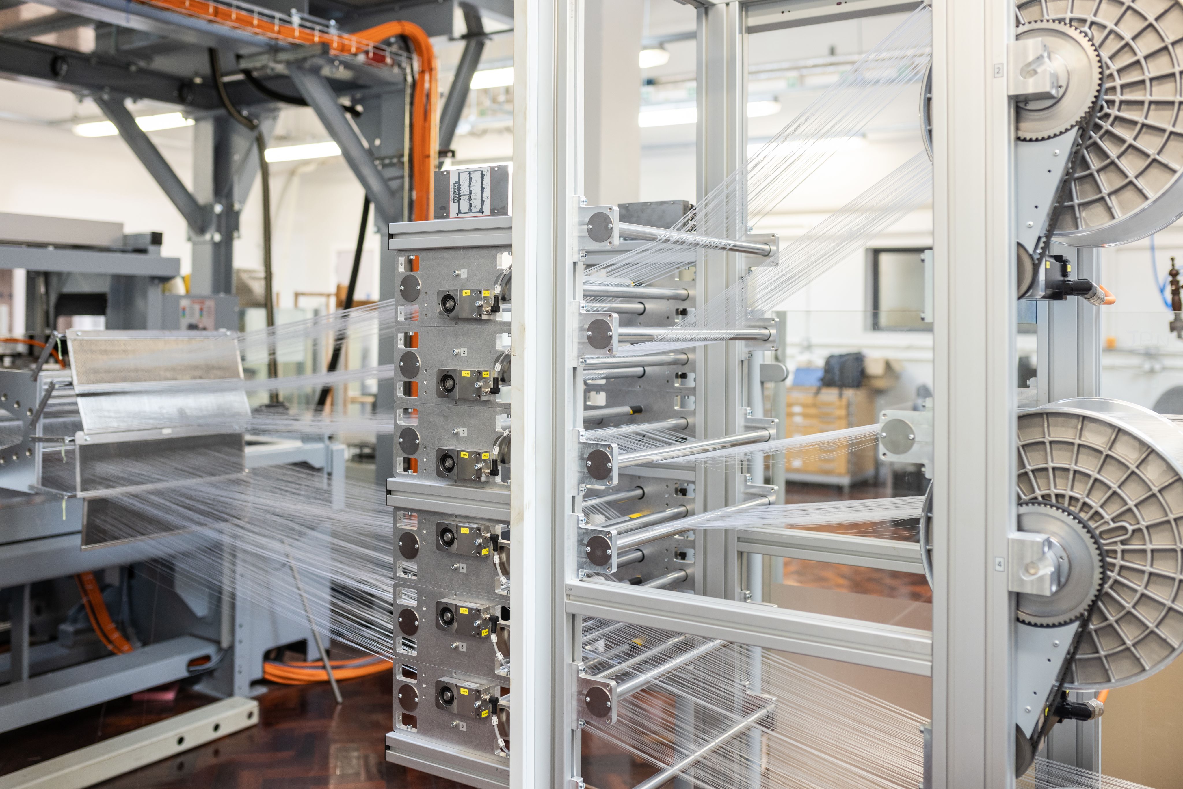 A three-dimensional weaving machine