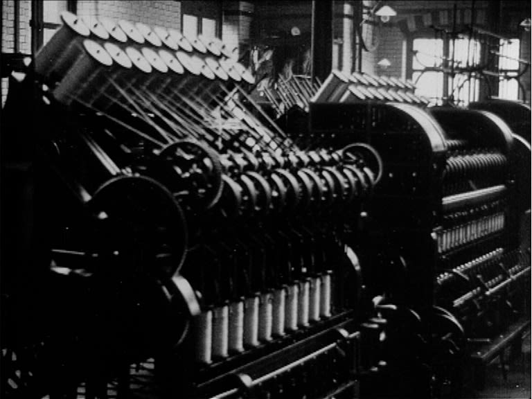 A black and white image of an old textiles machine