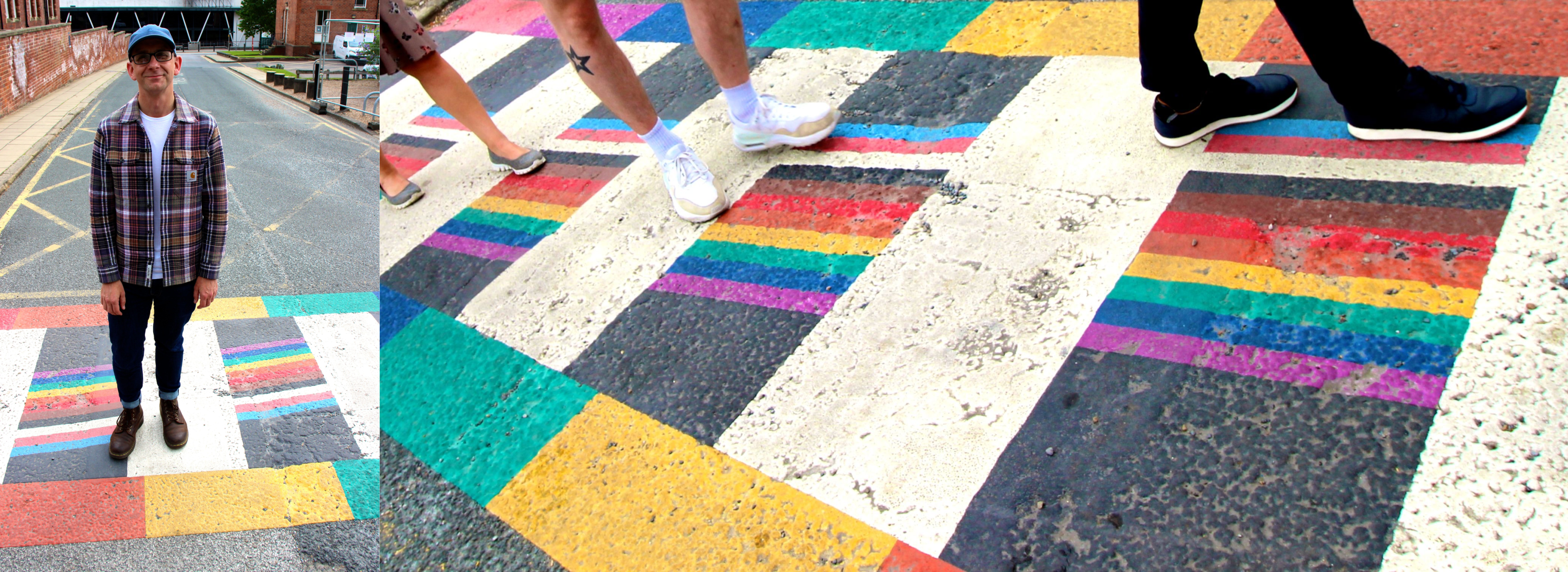 Paul Johnson stands on a zebra crossing which is painted in the colours of the Pride flag