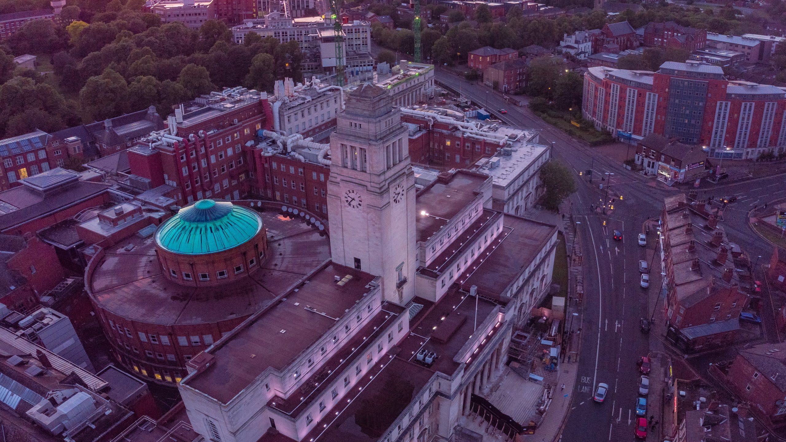 An aerial view of campus, including the Parkinson Tower and the domed roof of the Brotherton library