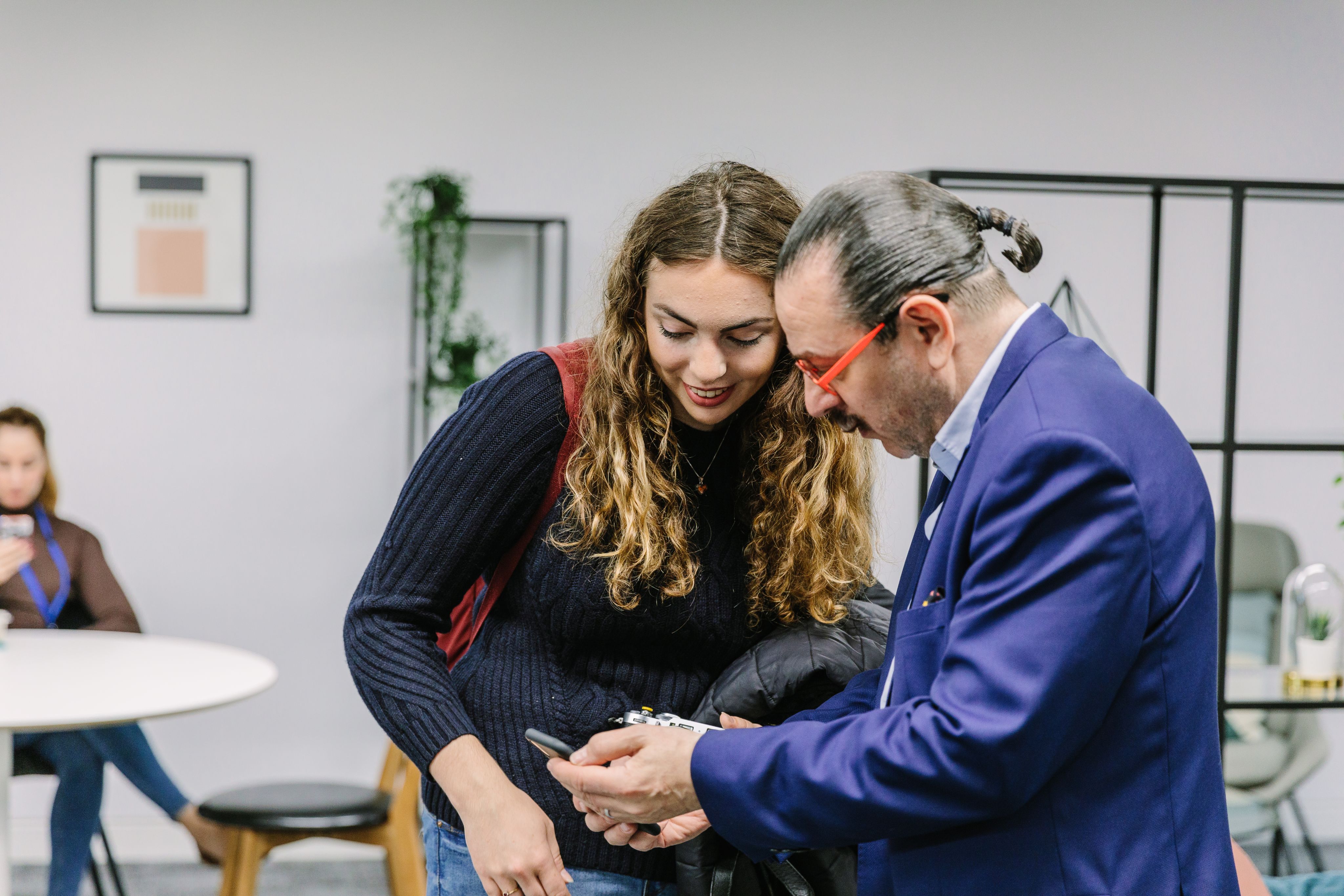 A student in conversation with a visiting enterprise partner at the University of Leeds.
